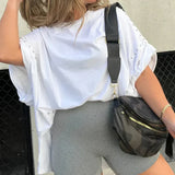 BELLA - CAMISETA OVERSIZE CON CLAVIJAS