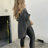 BELLA - CAMISETA OVERSIZE CON CLAVIJAS