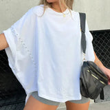 BELLA - CAMISETA OVERSIZE CON CLAVIJAS
